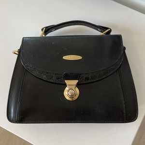 • vintage leather handled bag with gold hardware •